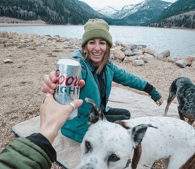 woman holding a can